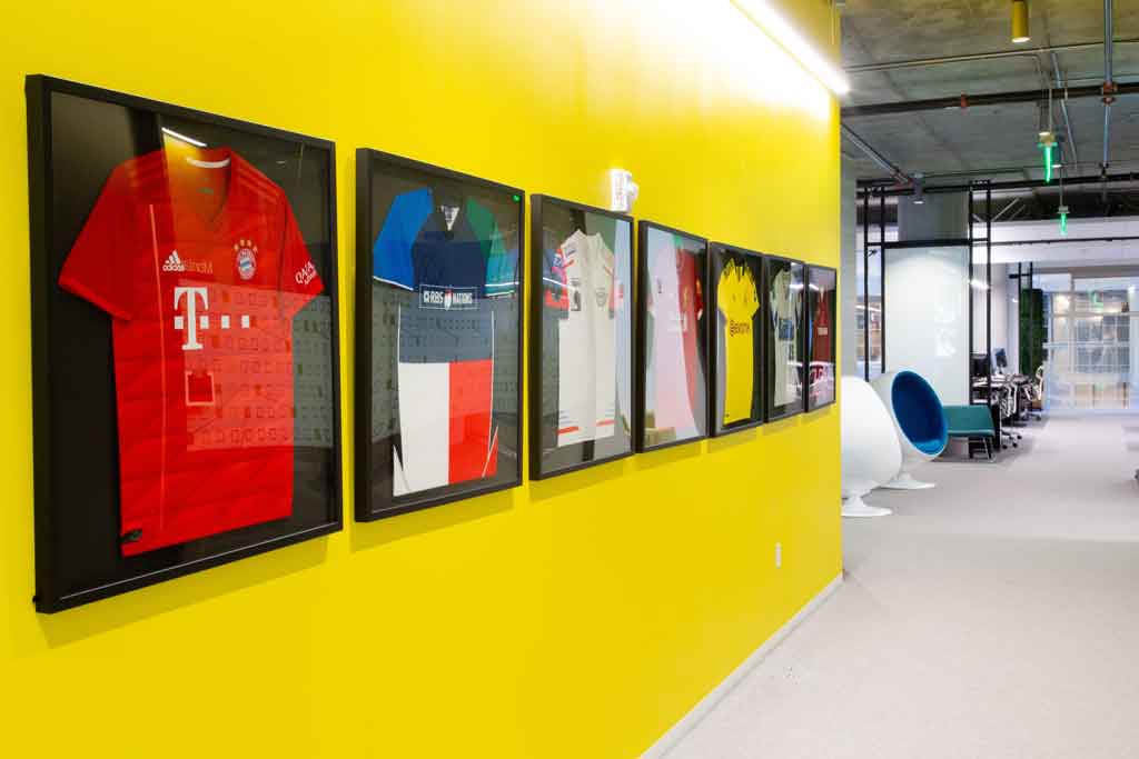 wall of framed jerseys in the Silicon Foundry hub